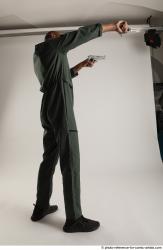 ERIC STANDING POSE WITH GUNS